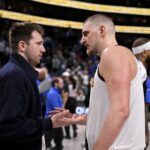 Dallas, Texas, USA; Luka Doncic (left) talks with Nikola Jokic (right) after a game between the Dallas Mavericks and Denver Nuggets at the American Airlines Center. Mandatory Credit: Jerome Miron-Imagn Images