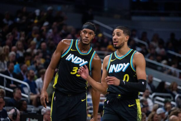 Indianapolis, Indiana, USA; Indiana Pacers center Myles Turner (33) and guard Tyrese Haliburton (0) in the first half against the Milwaukee Bucks at Gainbridge Fieldhouse. Mandatory Credit: Trevor Ruszkowski-Imagn Images