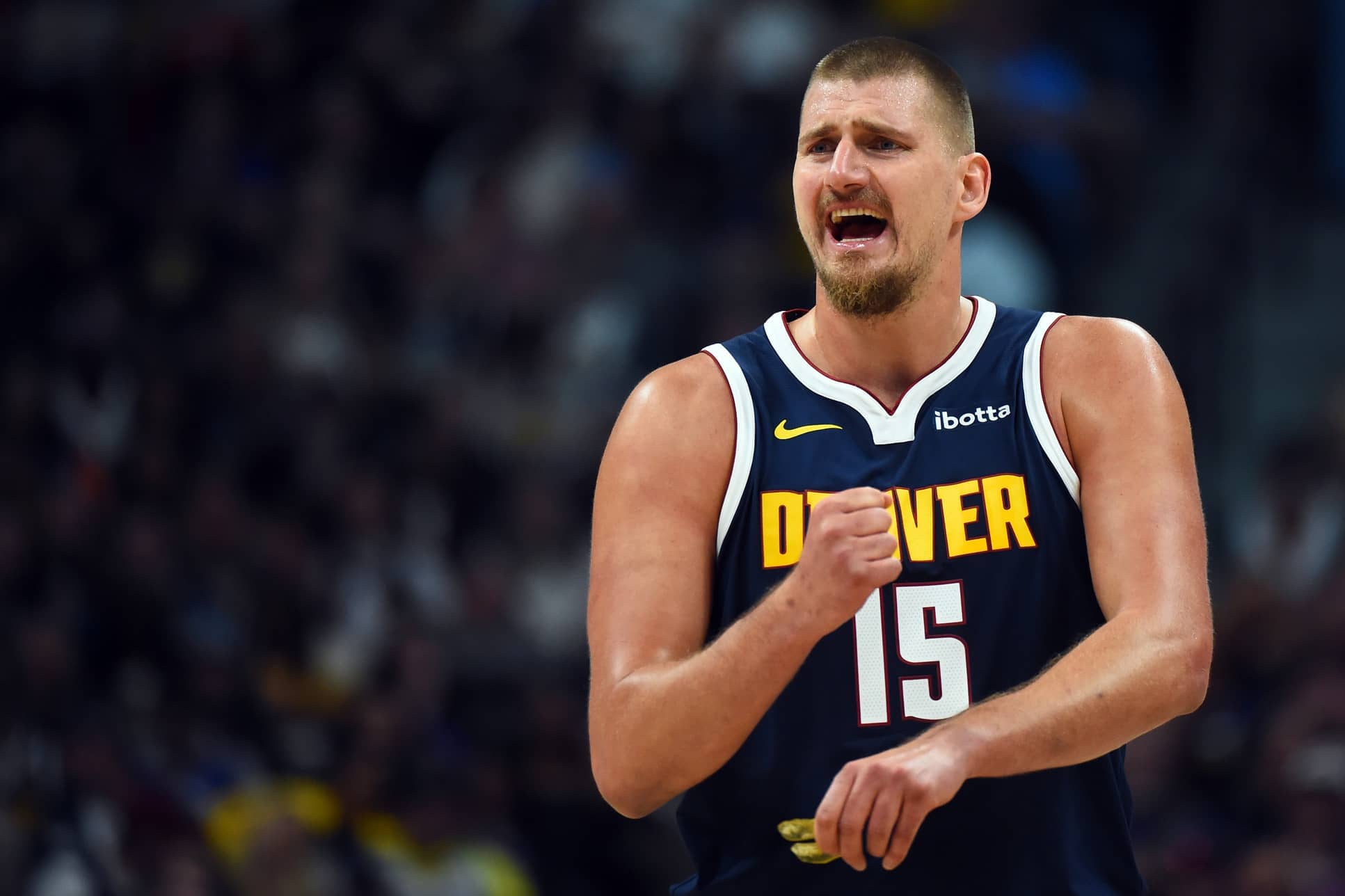 Denver, Colorado, USA; Denver Nuggets center Nikola Jokic (15) talks with the bench during the first half against the Phoenix Suns at Ball Arena. Mandatory Credit: Christopher Hanewinckel-Imagn Images
