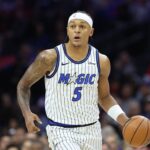 Philadelphia, Pennsylvania, USA; Orlando Magic forward Paolo Banchero (5) dribbles the ball against the Philadelphia 76ers during the first quarter at Xfinity Mobile Arena. Mandatory Credit: Bill Streicher-Imagn Images