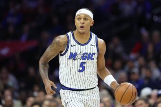 Philadelphia, Pennsylvania, USA; Orlando Magic forward Paolo Banchero (5) dribbles the ball against the Philadelphia 76ers during the first quarter at Xfinity Mobile Arena. Mandatory Credit: Bill Streicher-Imagn Images