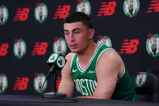 Boston, MA, USA; Boston Celtics guard Payton Pritchard (11) talks with reporters during media day at the Auerbach Center. Mandatory Credit: David Butler II-Imagn Images