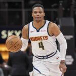 Atlanta, Georgia, USA; Denver Nuggets guard Russell Westbrook (4) brings the ball up the court against the Atlanta Hawks during the first half at State Farm Arena. Mandatory Credit: Dale Zanine-Imagn Images