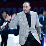 Chicago, Illinois, USA; Team Stephen A. coach Stephen A. Smith gestures during lineup introductions before the NBA All Star-Celebrity Game at Wintrust Arena. Mandatory Credit: Quinn Harris-Imagn Images