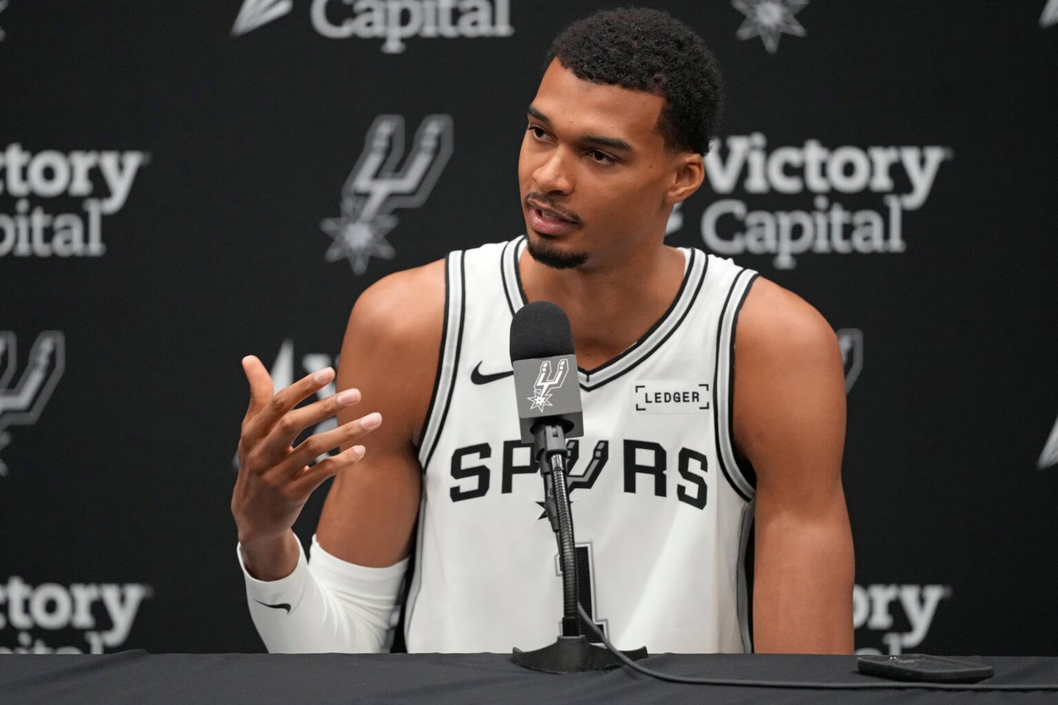 San Antonio, TX, USA; San Antonio Spurs forward-center Victor Wembanyama (1) answers questions from the media during Media Day at Victory Capital Performance Center in San Antonio. Mandatory Credit: Scott Wachter-Imagn Images