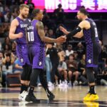 Apr 11, 2025; Sacramento, California, USA; Sacramento Kings forward DeMar DeRozan (10) talks with forward Domantas Sabonis (left) and guard Zach LaVine (😎 during the fourth quarter against the Los Angeles Clippers at Golden 1 Center. Mandatory Credit: Darren Yamashita-Imagn Images
