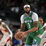 Dallas Mavericks forward Anthony Davis (3) controls the ball during the game between the Mavericks and the Raptors at the American Airlines Center.