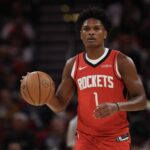 Houston Rockets guard Amen Thompson (1) dribbles against the Dallas Mavericks in the first quarter at Toyota Center.