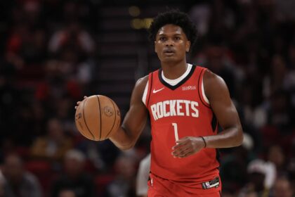Houston Rockets guard Amen Thompson (1) dribbles against the Dallas Mavericks in the first quarter at Toyota Center.