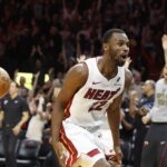Miami Heat forward Andrew Wiggins (22) reacts after he dunks to win the game against the Cleveland Cavaliers during overtime at Kaseya Center.