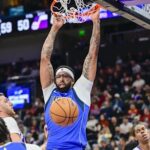Oct 13, 2025; Salt Lake City, Utah, USA; Dallas Mavericks forward/center Anthony Davis (3) makes a slam dunk over Utah Jazz center Jusuf Nurkić (30) during the second quarter at Delta Center. Mandatory Credit: Peter Creveling-Imagn Images