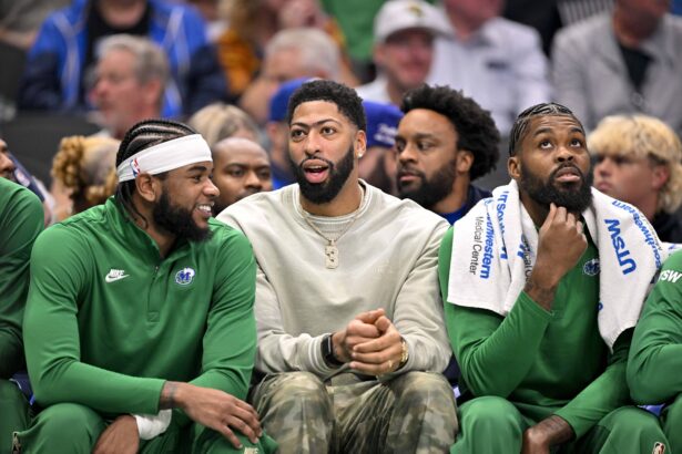 forward Anthony Davis (3) and forward Naji Marshall (13) look on during the first quarter against the Phoenix Suns at the American Airlines Center.