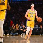 Apr 11, 2025; Los Angeles, California, USA; Los Angeles Lakers guard Austin Reaves (15) moves the ball against the Houston Rockets during the first half at Crypto.com Arena. Mandatory Credit: Jonathan Hui-Imagn Images