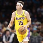 Los Angeles Lakers guard Austin Reaves (15) brings the ball up the court during the second quarter against the Charlotte Hornets at Spectrum Center.