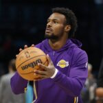 Los Angeles Lakers guard Bronny James (9) warms up prior to the game against the Charlotte Hornets at Spectrum Center.