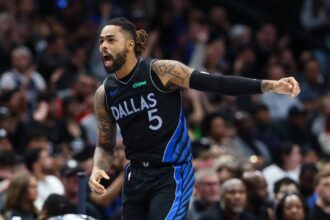 Dallas Mavericks guard D'Angelo Russell (5) reacts after scoring during the second half against the Portland Trail Blazers at American Airlines Center.