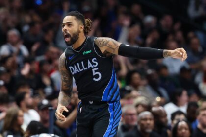 Dallas Mavericks guard D'Angelo Russell (5) reacts after scoring during the second half against the Portland Trail Blazers at American Airlines Center.