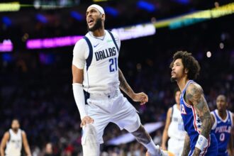 Feb 4, 2025; Philadelphia, Pennsylvania, USA; Dallas Mavericks forward Daniel Gafford (21) reacts after a rebound against the Philadelphia 76ers in the first quarter at Wells Fargo Center. Mandatory Credit: Kyle Ross-Imagn Images