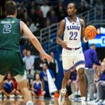 Nov 3, 2025; Lawrence, Kansas, USA; Kansas Jayhawks guard Darryn Peterson (22) dribbles the ball during the second half against the Green Bay Phoenix at Allen Fieldhouse. Mandatory Credit: Jay Biggerstaff-Imagn Images