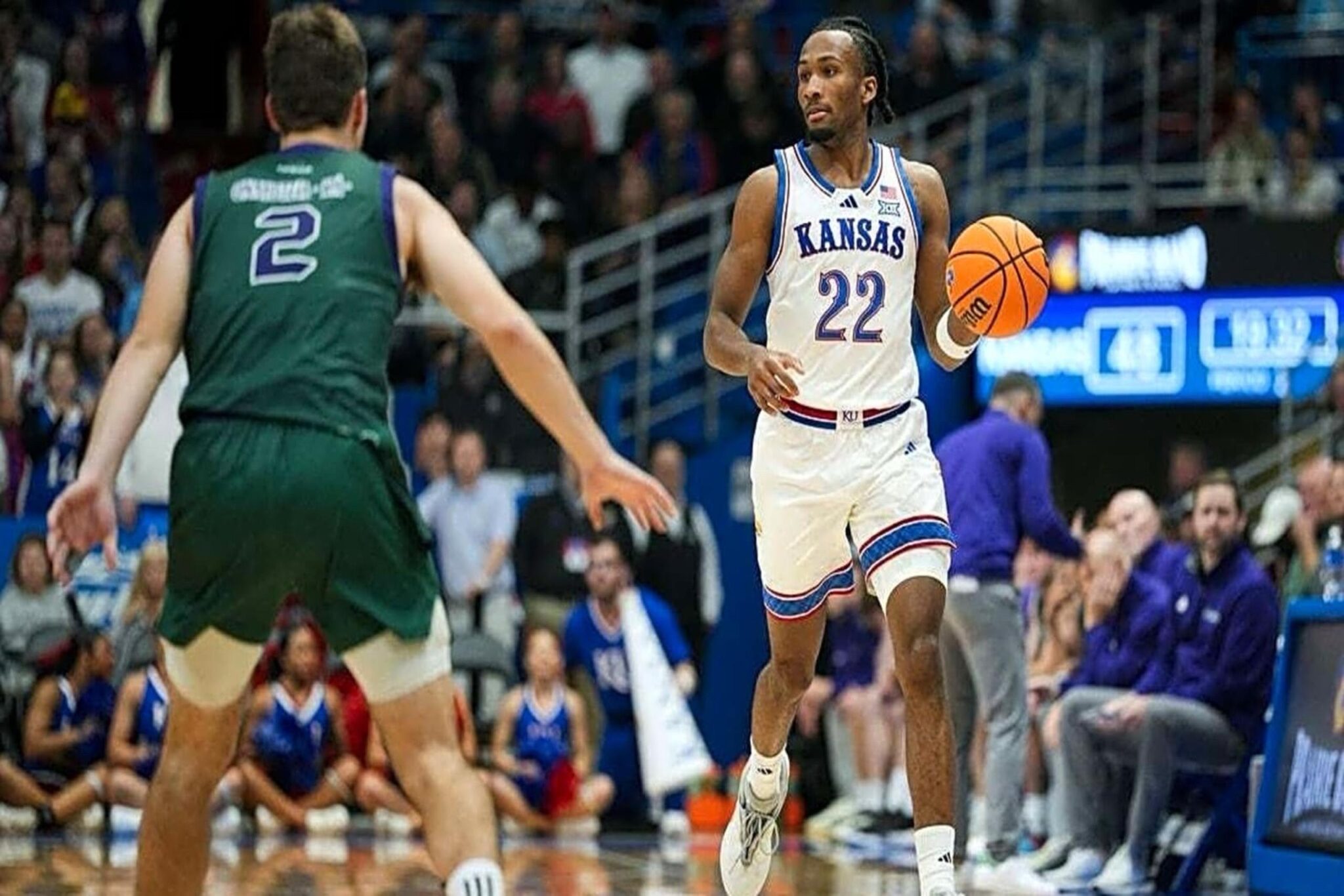 Nov 3, 2025; Lawrence, Kansas, USA; Kansas Jayhawks guard Darryn Peterson (22) dribbles the ball during the second half against the Green Bay Phoenix at Allen Fieldhouse. Mandatory Credit: Jay Biggerstaff-Imagn Images