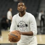 Oct 30, 2025; San Antonio, Texas, USA; San Antonio Spurs guard De’Aaron Fox (4) warms up before a game against the Miami Heat at Frost Bank Center. Mandatory Credit: Scott Wachter-Imagn Images
