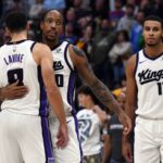 Sacramento Kings guard DeMar DeRozan (10) celebrates with guard Zach LaVine (8) after a made shot late in the second half of a win against the Denver Nuggets at Ball Arena.