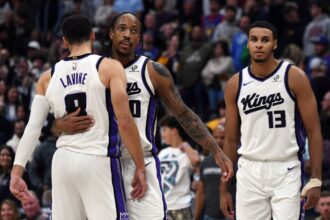 Sacramento Kings guard DeMar DeRozan (10) celebrates with guard Zach LaVine (8) after a made shot late in the second half of a win against the Denver Nuggets at Ball Arena.
