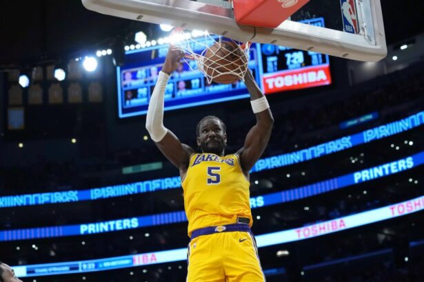Oct 24, 2025; Los Angeles, California, USA; Los Angeles Lakers center Deandre Ayton (5) dunks the ball in the second half against the Minnesota Timberwolves at Crypto.com Arena. Mandatory Credit: Kirby Lee-Imagn Images
