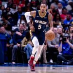 New Orleans Pelicans guard Dejounte Murray (5) brings the ball up court against the Utah Jazz during the first half at Smoothie King Center.