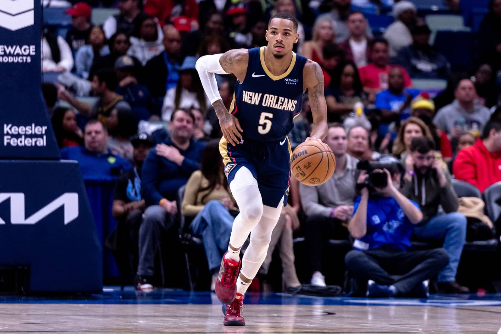New Orleans Pelicans guard Dejounte Murray (5) brings the ball up court against the Utah Jazz during the first half at Smoothie King Center.
