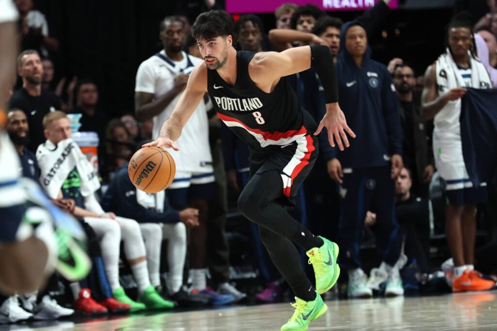 Portland Trail Blazers forward Deni Avdija (8) brings the ball up the court against the Minnesota Timberwolves in the second half at Moda Center.