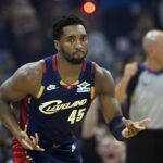 Cleveland Cavaliers guard Donovan Mitchell (45) celebrates his three-point basket in the first quarter against the Philadelphia 76ers at Rocket Arena.