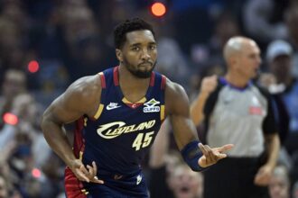 Cleveland Cavaliers guard Donovan Mitchell (45) celebrates his three-point basket in the first quarter against the Philadelphia 76ers at Rocket Arena.