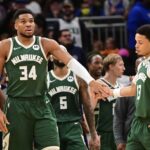 Milwaukee Bucks forward Giannis Antetokounmpo (34) reacts with guard Ryan Rollins (13) after scoring a basket in the 3rd quarter against the Sacramento Kings at Fiserv Forum.