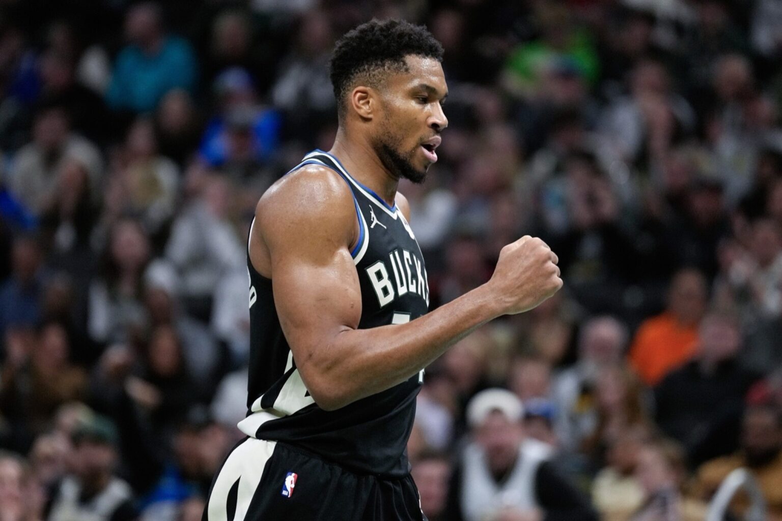 Nov 14, 2025; Milwaukee, Wisconsin, USA; Milwaukee Bucks forward Giannis Antetokounmpo (34) punts his fist following a Milwaukee Bucks score during the third quarter against the Charlotte Hornets at Fiserv Forum. Mandatory Credit: Jeff Hanisch-Imagn Images