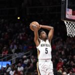 Nov 5, 2022; Atlanta, Georgia, USA; New Orleans Pelicans forward Herb Jones (5) dunks against the New Orleans Pelicans in the second quarter at State Farm Arena. Mandatory Credit: Larry Robinson-Imagn Images
