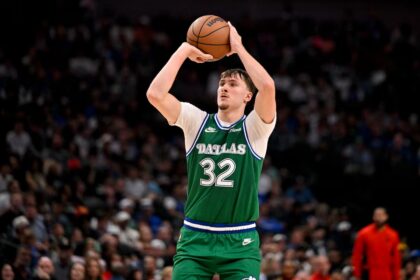 Oct 26, 2025; Dallas, Texas, USA; Dallas Mavericks forward Cooper Flagg (32) makes a three point shot against the Toronto Raptors during the second half at the American Airlines Center. Mandatory Credit: Jerome Miron-Imagn Images