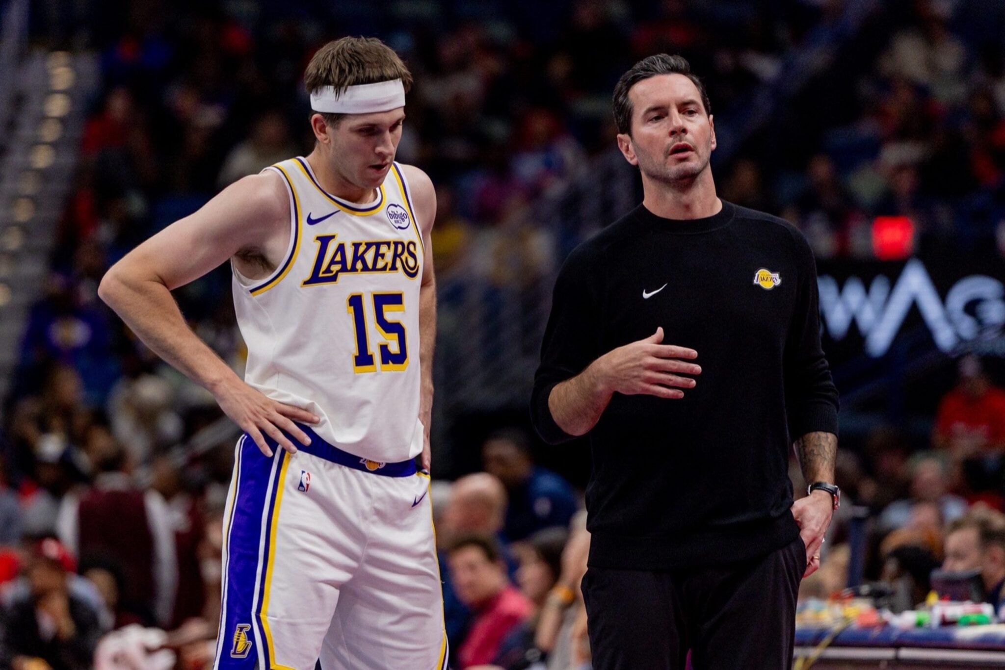 Nov 14, 2025; New Orleans, Louisiana, USA; Los Angeles Lakers guard Austin Reaves (15) talks to Head Coach JJ Redick on a time out against the New Orleans Pelicans during the first half at Smoothie King Center. Mandatory Credit: Stephen Lew-Imagn Images