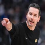 Oct 26, 2025; Sacramento, California, USA; Los Angeles Lakers head coach JJ Redick makes a call to the bench during the first quarter of the game against the Sacramento Kings at Golden 1 Center. Mandatory Credit: Ed Szczepanski-Imagn Images