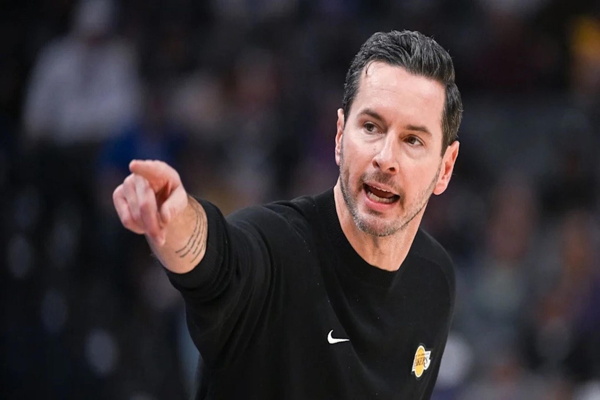 Oct 26, 2025; Sacramento, California, USA; Los Angeles Lakers head coach JJ Redick makes a call to the bench during the first quarter of the game against the Sacramento Kings at Golden 1 Center. Mandatory Credit: Ed Szczepanski-Imagn Images