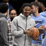 Memphis Grizzlies guard Ja Morant (12) looks on from the team bench during the second half against the Dallas Mavericks at the American Airlines Center.