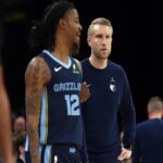 Nov 3, 2025; Memphis, Tennessee, USA; Memphis Grizzlies head coach Tuomas Iisalo looks on as guard Ja Morant (12) checks into the game during the second quarter against the Detroit Pistons at FedExForum. Mandatory Credit: Petre Thomas-Imagn Images