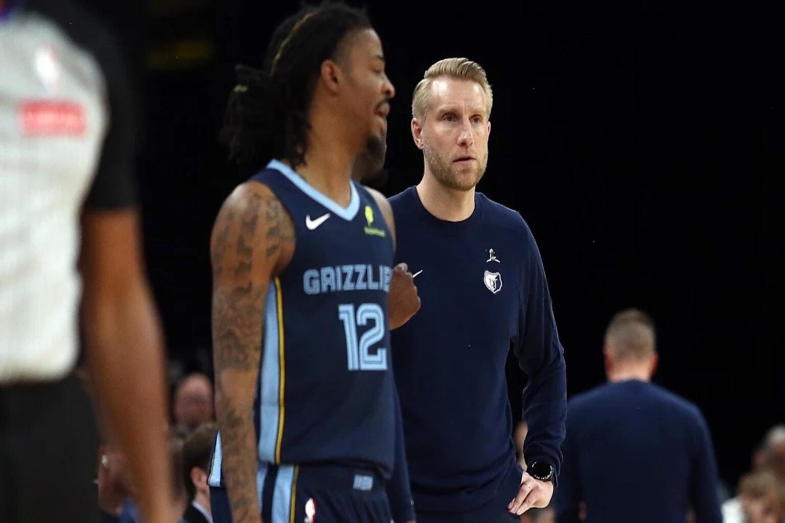 Nov 3, 2025; Memphis, Tennessee, USA; Memphis Grizzlies head coach Tuomas Iisalo looks on as guard Ja Morant (12) checks into the game during the second quarter against the Detroit Pistons at FedExForum. Mandatory Credit: Petre Thomas-Imagn Images