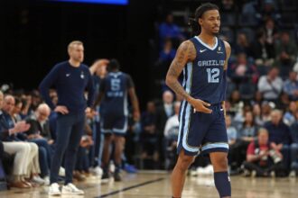 Memphis Grizzlies guard Ja Morant (12) checks into the game during the second quarter against the Detroit Pistons at FedExForum.