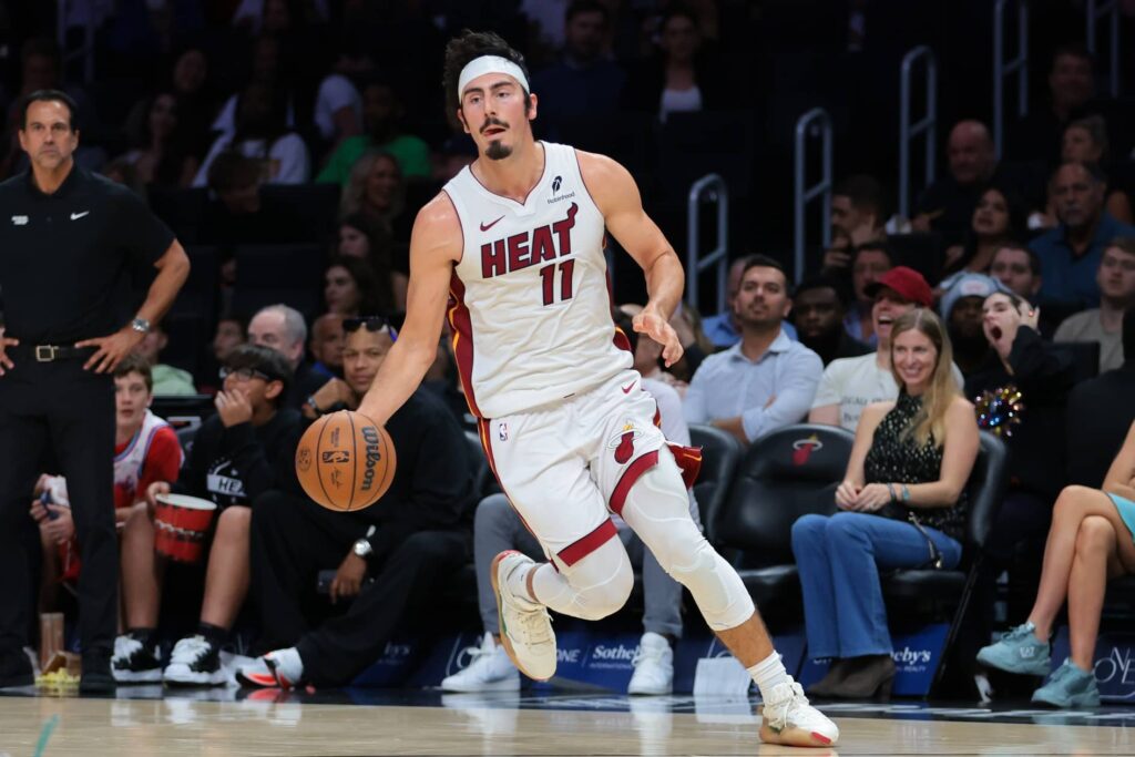 Miami Heat guard Jaime Jaquez Jr. (11) drives to the basket against Charlotte Hornets during the fourth quarter at Kaseya Center.
