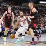 Chicago Bulls center Nikola Vucevic (9) defends against New York Knicks guard Jalen Brunson (11) during the second half at United Center.