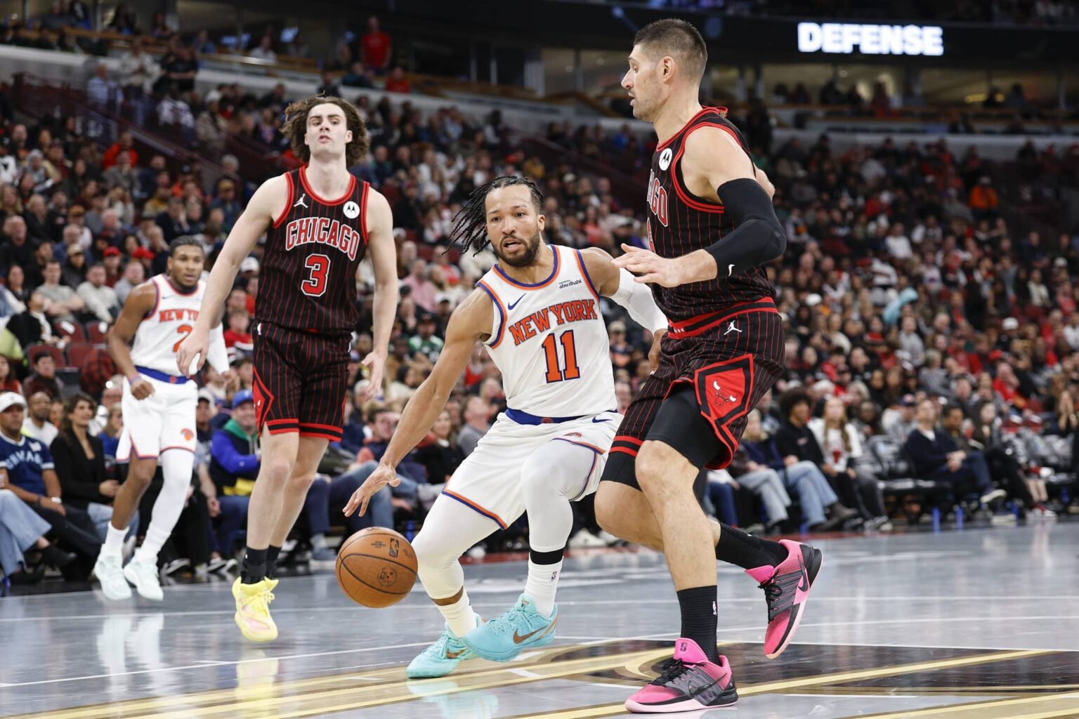 Chicago Bulls center Nikola Vucevic (9) defends against New York Knicks guard Jalen Brunson (11) during the second half at United Center.