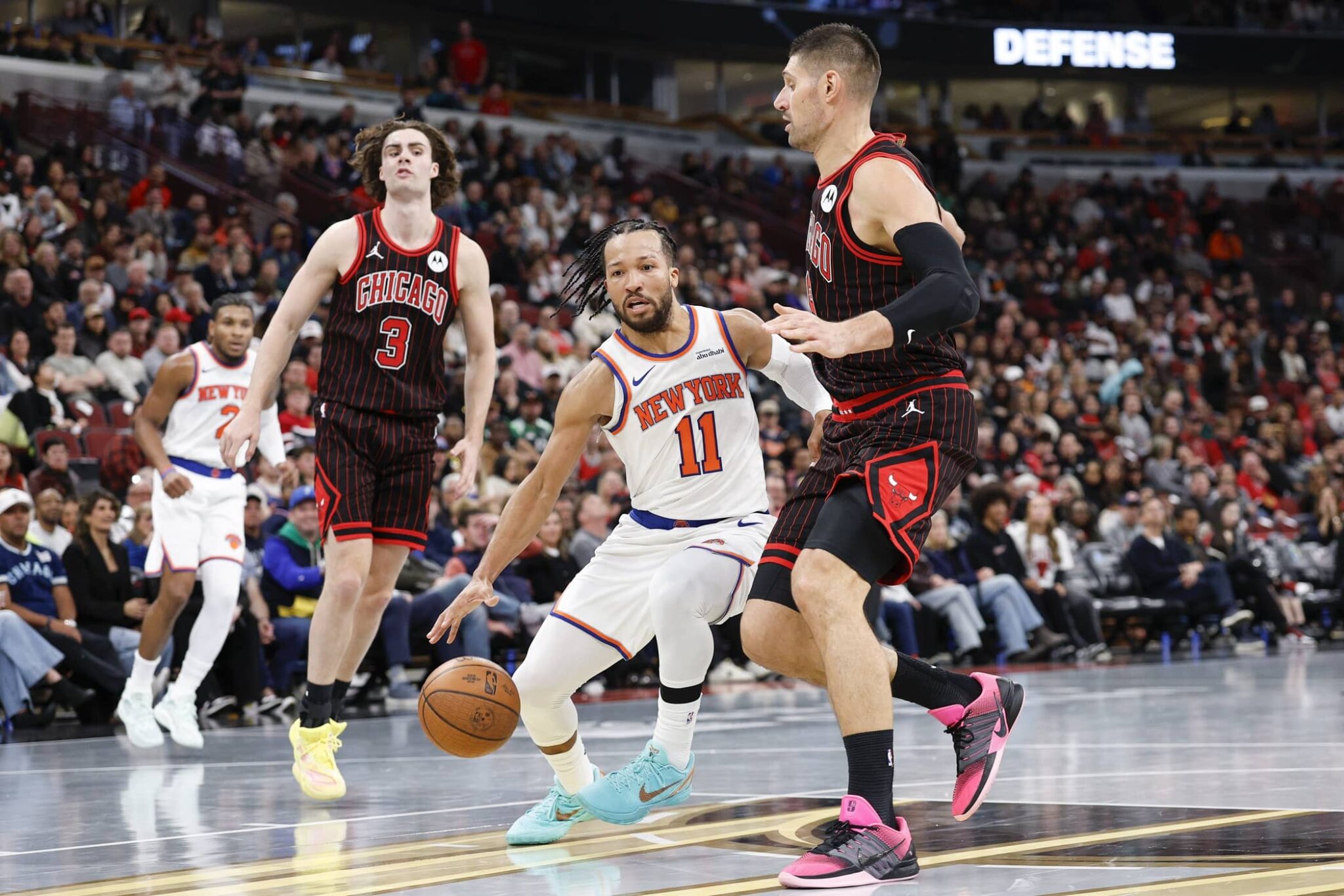 Chicago Bulls center Nikola Vucevic (9) defends against New York Knicks guard Jalen Brunson (11) during the second half at United Center.
