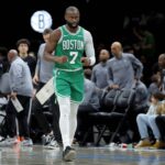 Boston Celtics guard Jaylen Brown (7) reacts during the fourth quarter against the Brooklyn Nets at Barclays Center.
