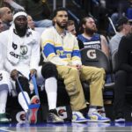 Nov 7, 2025; Orlando, Florida, USA; Boston Celtics forward Jayson Tatum (0) (center) looks on during a game against the Orlando Magic in the first quarter at Kia Center. Mandatory Credit: Nathan Ray Seebeck-Imagn Images